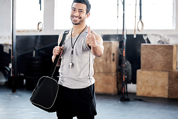 Image showing Portrait, thumbs up and happy man in gym with bag for sports goals, fitness target and training. Face, like hand gesture and Asian athlete with emoji for support, success and thank you for exercise.