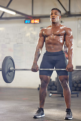 Image showing Fitness, muscle and a black man bodybuilder with a barbell in the gym during a physical workout routine. Exercise, strong and sweat with a shirtless male athlete lifting weights in a sports center