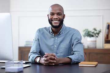 Image showing Happy, desk and portrait of black man entrepreneur in corporate company or agency office arms crossed. Professional, African and young person or employee ready for business development with a smile