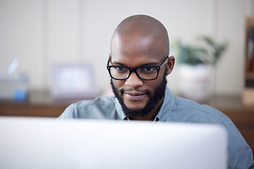 Image showing IT, computer and black man work on business software, coding or email in office. Desktop, programmer and African professional working on cyber security, software or internet research for programming.