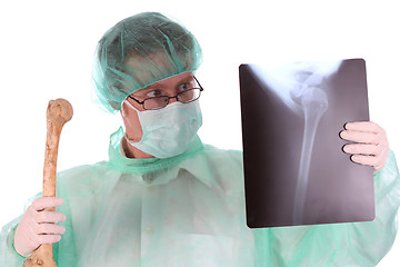 Image showing surgeon with xray and bone