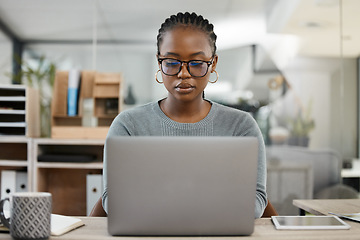 Image showing Laptop, office and business black woman typing online for research, internet and browse website. Corporate, professional and female worker busy on computer working on report, project and planning