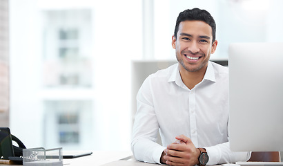 Image showing Happy, portrait of a businessman and computer working at his desk at his workplace office. Happiness or cheerful, health wellness and male person happy at his workstation by desktop at work.