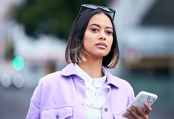 Image showing Phone, road and a woman customer shopping in the city for a fashion sale, deal or bargain for retail. Mobile, street and app with a young female shopper in an urban town for commercial consumerism