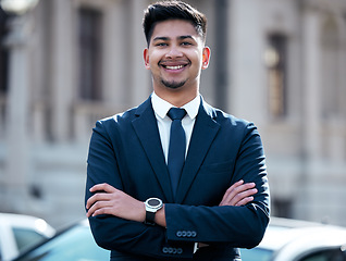 Image showing Portrait, lawyer and business man with arms crossed in city, smile and outdoor in urban street. Face, happy and confident professional, entrepreneur and male attorney from India with success mindset.