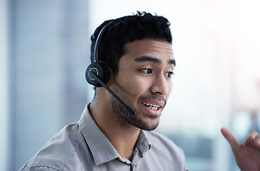 Image showing Talking, call center and business man telemarketing, customer service and support in office. Crm, contact us and Asian male sales agent, consultant and professional working, consulting or help desk