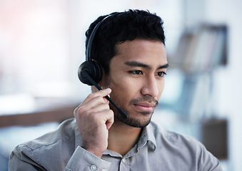 Image showing Call center, listening and business man telemarketing, customer service and support in office. Crm, contact us and Asian male sales agent, consultant and professional working, consulting or help desk