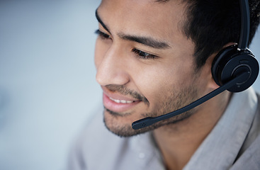 Image showing Call center, telemarketing and business man smile for customer service, support and listening in office mockup. Crm, contact us and Asian male sales agent, consultant and employee consulting for help