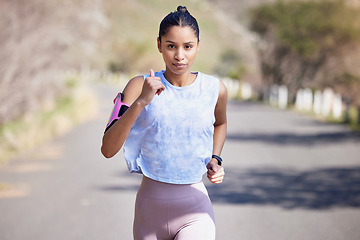 Image showing Running, portrait and serious woman for outdoor fitness, exercise and cardio, marathon training and speed. Fast, focus and runner, athlete or female person for sports workout and challenge in street