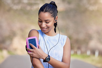 Image showing Phone, arm and woman for outdoor fitness music, wellness podcast and exercise progress, heart and cardio health. Biometric, data and mobile app of athlete, runner or sports person listening in street