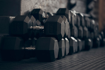 Image showing Dumbbell, empty gym and metal for exercise on floor for power, sport or abstract background. Fitness, workout and training with iron weights for bodybuilding, health or wellness club membership