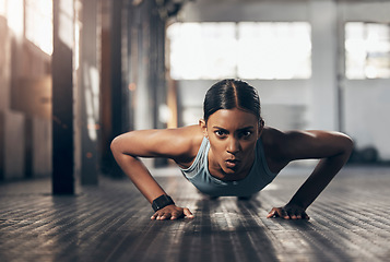 Image showing Push ups, workout and portrait of woman in gym for challenge, exercise and performance. Health, strong and sports with female bodybuilder training in fitness center for energy, wellness and focus