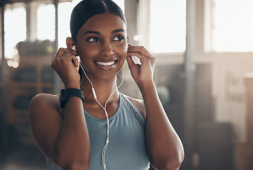 Image showing Woman, gym and music with thinking, fitness vision and inspiration for workout, training and wellness. Indian girl, audio or streaming subscription for listening, exercise and happiness for self care