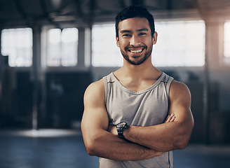 Image showing Fitness, smile and portrait of a personal trainer with crossed arms in the gym before a strength workout. Confidence, happy and male athlete after a bodybuilding arm exercise in a sports center.