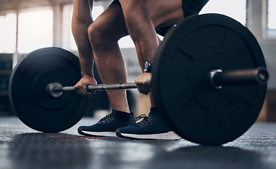 Image showing Gym, fitness and man with hand for lift weight in a closeup for a workout with athletic body . Male trainer, barbell and lifting with exercise for strong muscle at the club for training for sport.