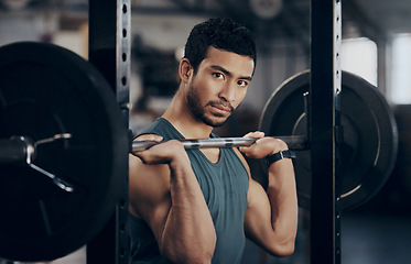 Image showing Man, portrait and push press barbell for workout at the gym for strong muscles in a close up. Male athlete, exercise and weight lift for fitness at a club with equipment for healthy body with cardio.