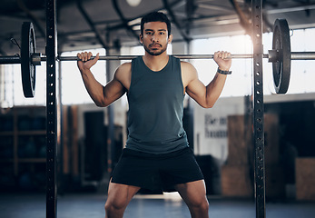 Image showing Portrait, exercise and man with barbell in gym for fitness, strong muscle power or health. Bodybuilder, training and face of male athlete weightlifting for wellness, sports and serious squat workout.