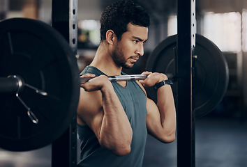 Image showing Exercise, workout and man with barbell in gym for fitness, strong muscle power or health. Bodybuilder, training and male athlete weightlifting for wellness, sports and serious focus on shoulder press