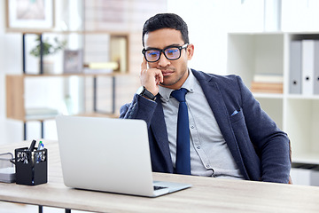 Image showing Businessman in glasses, thinking or reading on laptop in office, desk or corporate workplace with professional employee. Man, business and focus on working, planning or entrepreneur busy on computer