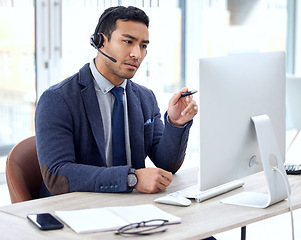 Image showing Call center, computer and business man, IT consultant or technical support agent talk, communication and advice. Helping, callcenter and solution of asian person on desktop for information technology