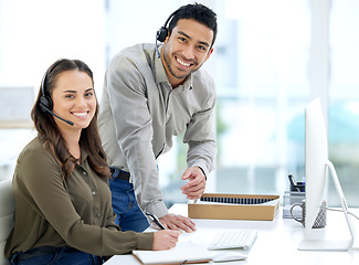 Image showing Call center, man coaching woman and smile in portrait, office and writing notes for learning at telemarketing job. Crm, teaching and notebook for customer service, consulting and tech support with pc