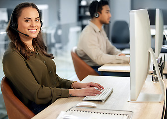 Image showing Woman typing at computer, call center and contact us with communication and CRM with tech support. Customer service, help desk and telemarketing, female consultant and smile in portrait with telecom