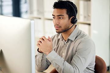 Image showing Man at computer, call center and headset with contact us, communication and CRM with tech support. Customer service, help desk and telemarketing with serious male consultant and professional service