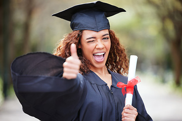 Image showing Thank you, portrait of college student with thumbs up and winking for success at her campus outdoors. Achievement, graduate and female person with her certificate or diploma at university outside