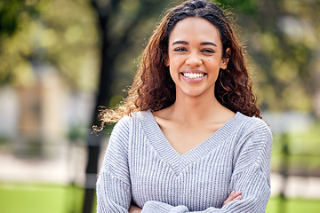 Image showing Happy, portrait of black woman and arms crossed in a nature park outdoors. Happiness or positive, confident or proud and excited or cheerful African female person outside for health wellness.