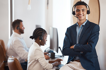 Image showing Call center, portrait and happy agent working in office of customer service, support or job in crm communication. Man, contact us and telemarketing sales employee or career in online consulting