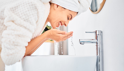 Image showing Water splash, skincare and happy woman washing her face in a bathroom for beauty, hygiene and wellness. Facial, cleaning and female with drops for dermatology and cleansing treatment in her home