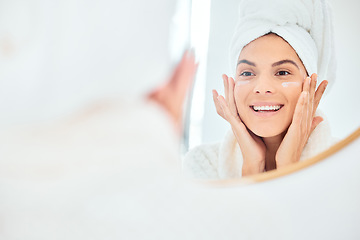 Image showing Mirror, skincare and face cream for woman in bathroom for dermatology, anti aging and wellness in her home. Facial, sunscreen and happy female person with lotion, spf or glowing skin beauty treatment