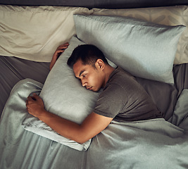 Image showing Sad, tired and depression with man in bedroom for burnout, fatigue and mental health. Anxiety, lonely and depressed with male person feeling grief in bed at home for frustrated, problem and morning