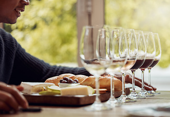 Image showing Wine tasting, cheese platter and luxury restaurant with alcohol and glass for customer. Eating, drink and sommelier with bottle for wines and food pairing in a fine dining and winery experience