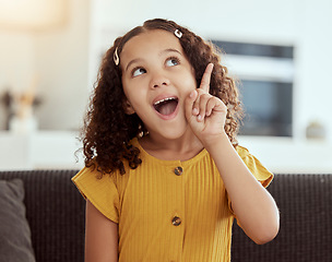 Image showing Thinking, happy girl and home with ideas and inspiration on a living room sofa. Surprise, decision and child with learning and consideration on a lounge couch in house with student knowledge and plan