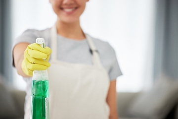 Image showing Bottle, cleaning spray and woman with gloves to clean house, surface or job working with washing detergent. Cleaner, service and apartment maintenance with a maid, helper or worker with products