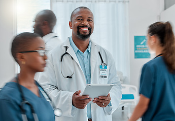 Image showing Busy hospital, tablet and portrait of doctor for medical care, wellness app and support with blur of people. Healthcare, digital tech and happy black man for service, consulting and health insurance