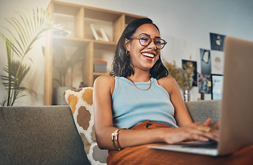 Image showing Laptop, young woman laugh and work from home with a smile writing for website. Happy freelancer, living room sofa and female person blogging on a lounge couch and typing a blog post on a computer