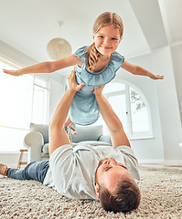 Image showing Portrait, dad and child in home for flying game, bonding and playful girl in living room for happy family. Happiness, father and daughter play airplane on floor with smile, support and love in house