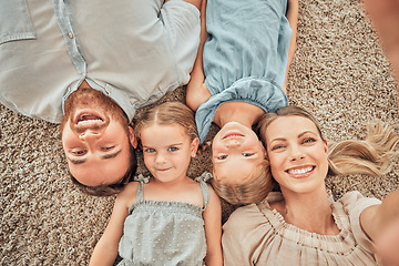 Image showing Top view, selfie and portrait of parents and children on living room floor for bonding, quality time and relax. Happy family, smile and mom and dad with girls for care, love and take picture at home