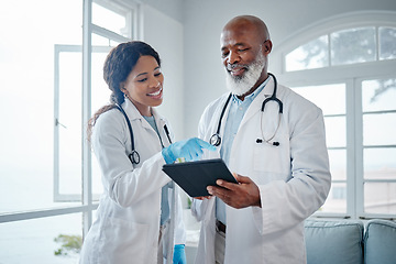 Image showing African doctors, teamwork and talk with tablet, data analysis or learning for healthcare in hospital. Senior black man, woman or medical mentor on touchscreen for research with wellness app in clinic