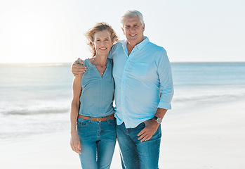 Image showing Mature, couple and beach with portrait on vacation hold for happiness or travel in summer. Senior, woman and man hug at the ocean on holiday in the outdoor with smile and sun for retirement.