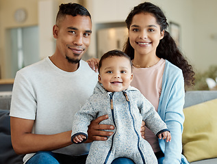 Image showing Family, smile and portrait of baby in home living room, bonding and having fun in house. Father, mother and face of child on sofa, relax with newborn and enjoying quality time together with happiness