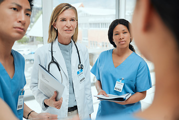 Image showing Teamwork, talking or doctors with leadership in meeting planning a surgery strategy in collaboration. Discussion, nurses or surgeons speaking of healthcare paperwork documents or research report