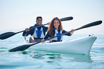 Image showing Kayak, rowing and couple on a boat at ocean, lake or river for water sports or fitness challenge. Portrait of happy man and woman with a paddle for adventure, teamwork exercise or travel in nature