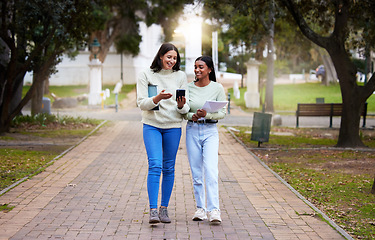 Image showing Happy, female students and friends with a smartphone walking together at university reading exam test results on a mobile app. Technology, smile and college girls on social media or chat on campus