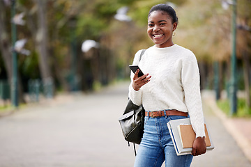 Image showing Portrait, phone and mock up with a student black woman on her commute to university campus for education. Mobile, social media and study material with a female college pupil checking her next lecture