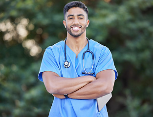 Image showing Man, nurse portrait and arms crossed of healthcare and wellness professional outdoor. Success, doctor motivation and nursing male person in nature with a smile from career confidence and work