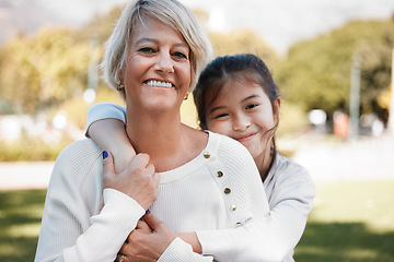 Image showing Girl, grandmother and portrait with happiness in the outdoor on the weekend in nature. Kid, grandma and hug in summer with smile on face for love and family in the garden with pride, care and bond.