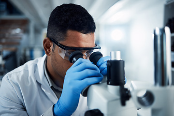 Image showing Man, scientist and microscope in forensic science research, discovery or data analysis at lab. Male person or medical professional in scientific results for cure, virus or vaccine in laboratory